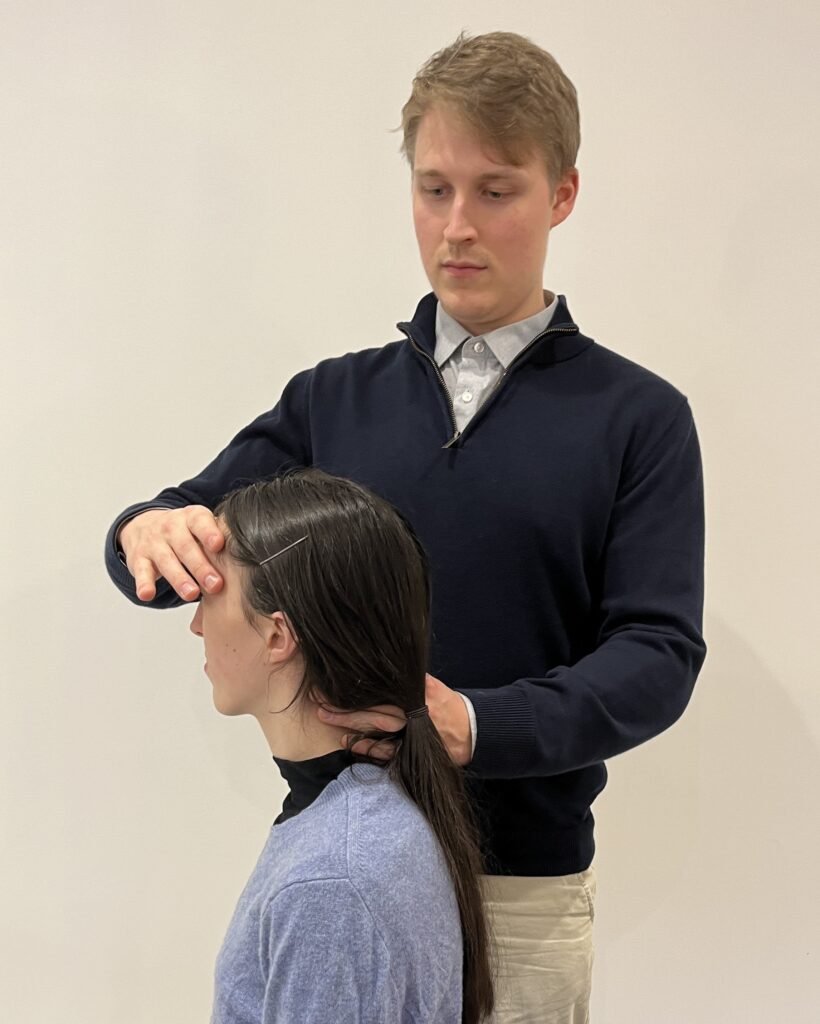 Dr Danel Daljajev treating a patient