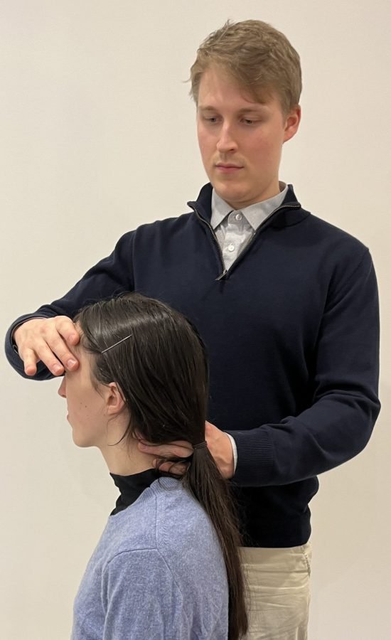 Dr Danel Daljajev treating a patient